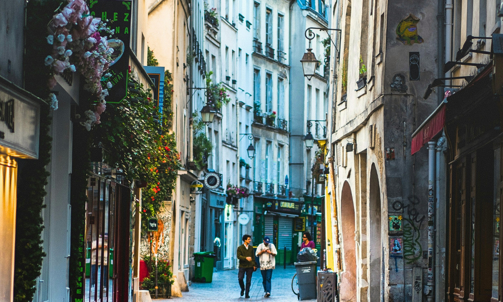 Le Marais neighborhood in Paris with cobblestone streets and historic buildings