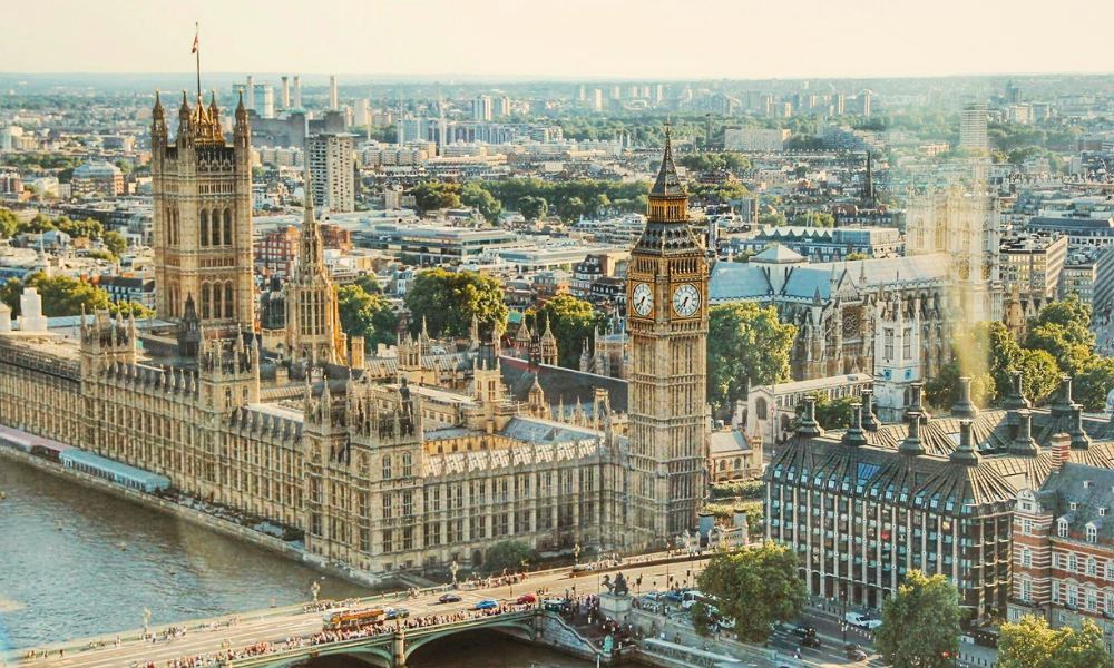 Aerial view of Big Ben and the Houses of Parliament in central London beside the River Thames.