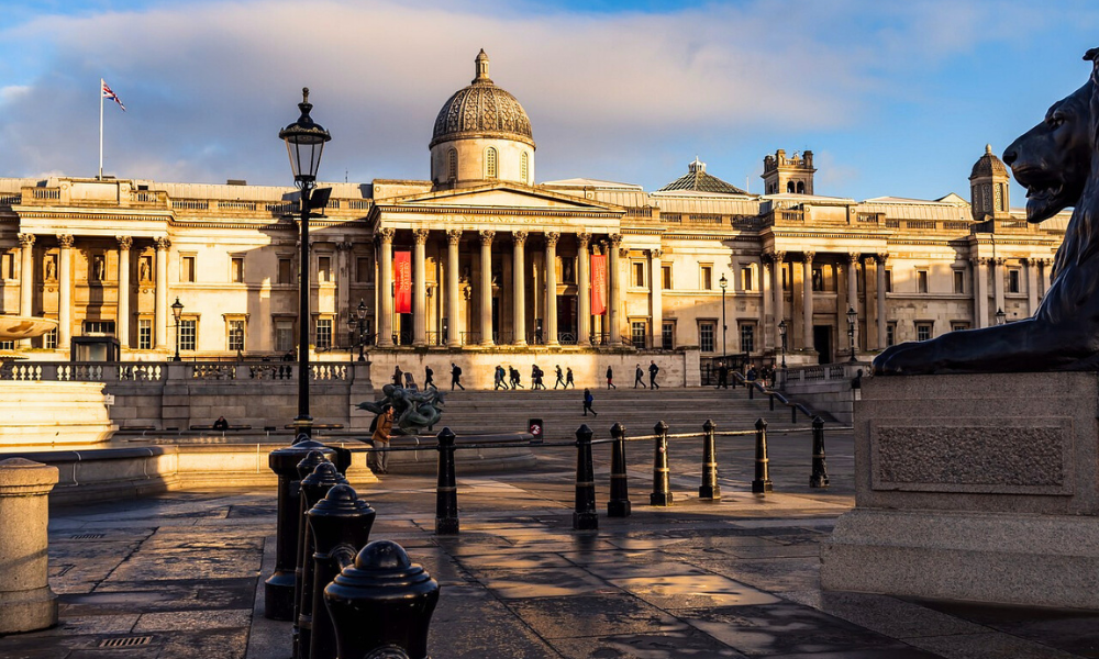 Exterior view of the National Gallery in London, showcasing its classical façade and entrance steps.