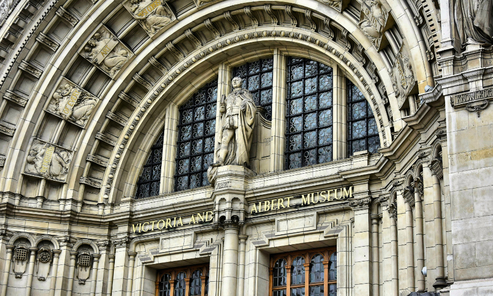 Front view of the Victoria and Albert Museum in London, showing the statue and the museum’s name on the façade.